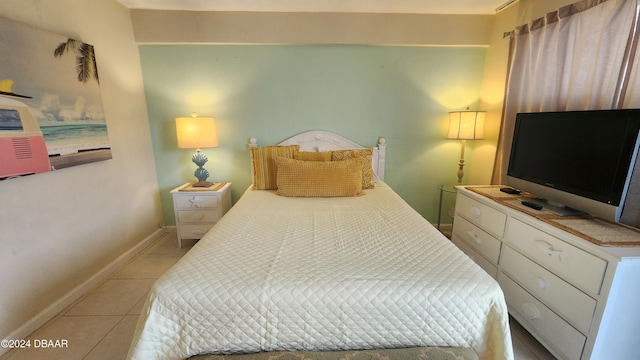 219 S Atlantic Ave Unit 235, Daytona Beach, FL 32118 - bedroom with light tile patterned flooring and baseboards