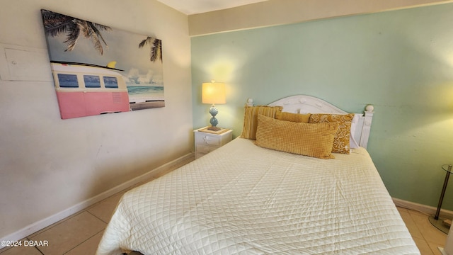 219 S Atlantic Ave Unit 235, Daytona Beach, FL 32118 - bedroom with tile patterned flooring and baseboards