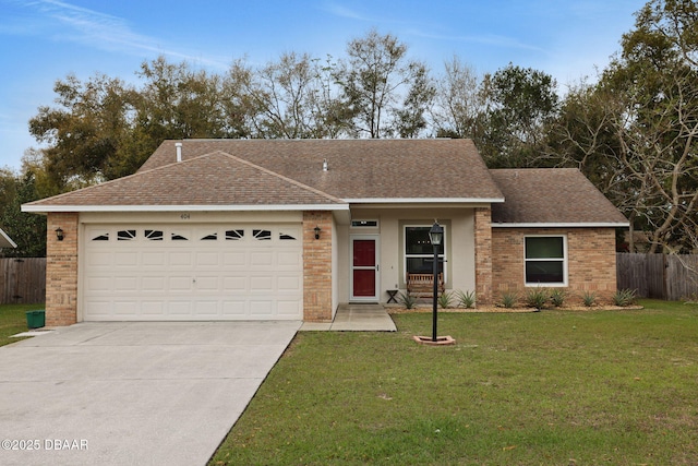 single story home with concrete driveway, an attached garage, fence, a front yard, and brick siding