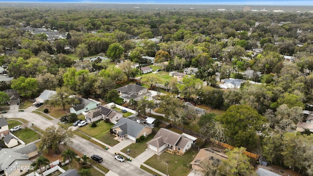 drone / aerial view with a forest view and a residential view