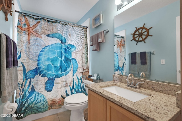 full bathroom featuring a shower with shower curtain, vanity, toilet, and tile patterned floors