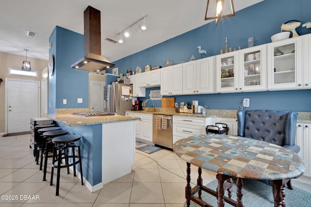 kitchen featuring stainless steel appliances, light tile patterned flooring, visible vents, and island range hood