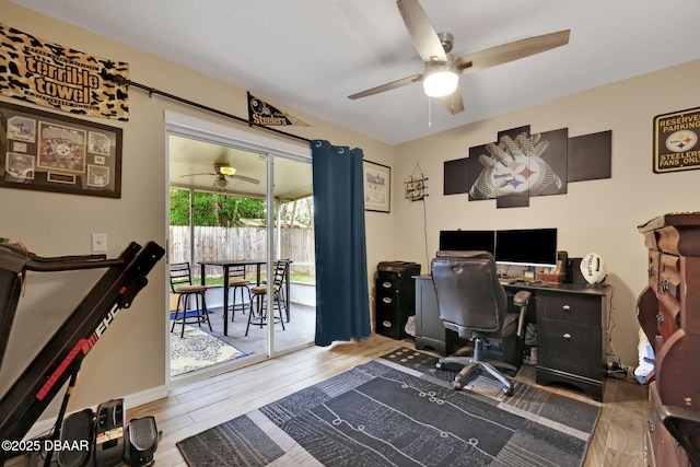 office space featuring a ceiling fan and wood finished floors