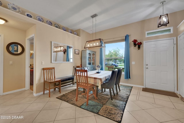 dining room with light tile patterned flooring and baseboards