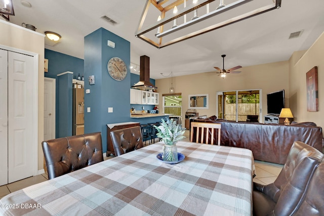 dining area with tile patterned flooring, visible vents, and a ceiling fan