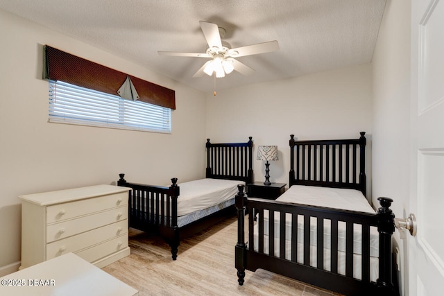 1133 Ocean Shore Blvd Unit 905, Ormond Beach, FL 32176 - bedroom with light wood-style floors and ceiling fan
