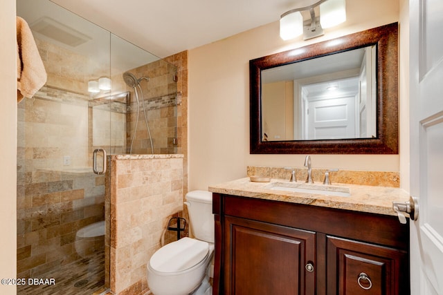 1133 Ocean Shore Blvd Unit 905, Ormond Beach, FL 32176 - bathroom featuring toilet, vanity, and a stall shower