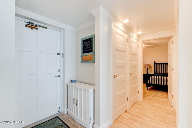 1133 Ocean Shore Blvd Unit 905, Ormond Beach, FL 32176 - foyer entrance featuring ornamental molding, light wood finished floors, recessed lighting, baseboards, and ceiling fan