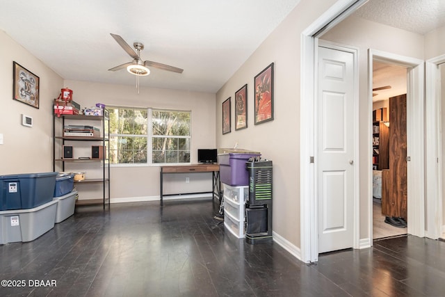 office space featuring ceiling fan, a textured ceiling, and dark hardwood / wood-style flooring