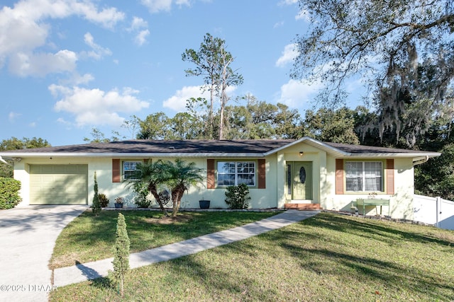 ranch-style house with a garage and a front lawn