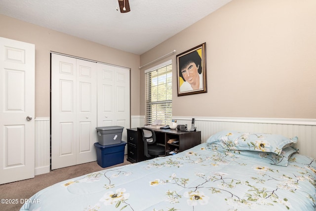 bedroom with carpet floors, a closet, and ceiling fan