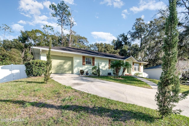 ranch-style house with a front yard and a garage