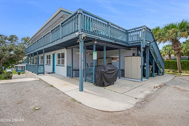 view of side of home featuring a deck