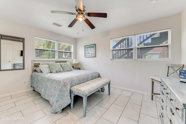 bedroom featuring ceiling fan and light tile patterned floors