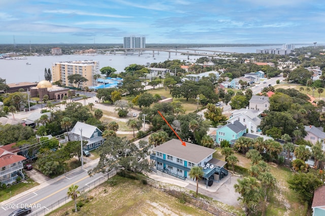 birds eye view of property with a water view