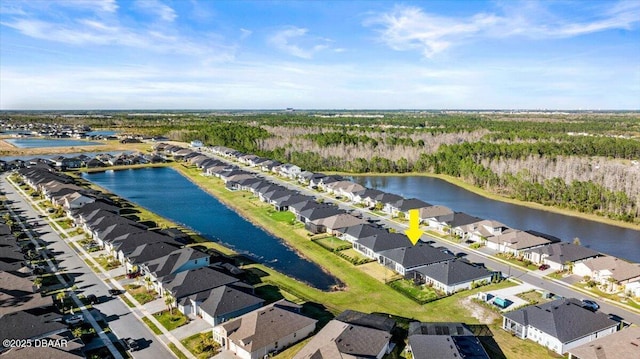 bird's eye view with a residential view and a water view