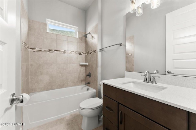 bathroom with toilet, vanity, and bathtub / shower combination