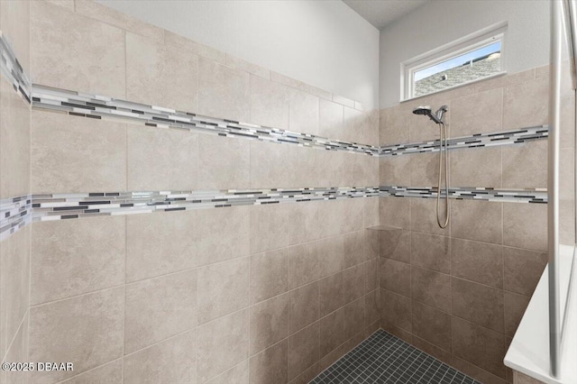 bathroom with a tile shower