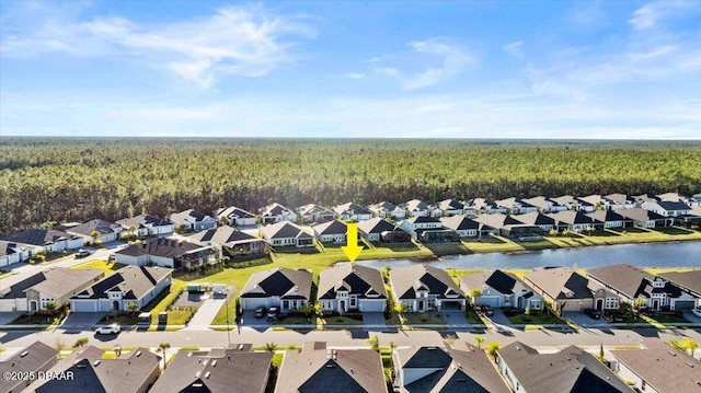 aerial view featuring a residential view and a water view