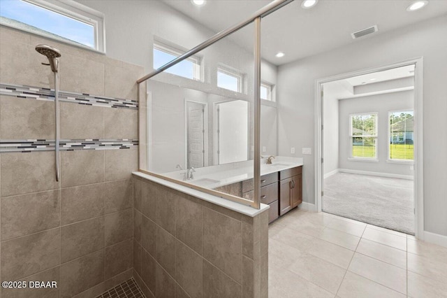 full bathroom featuring vanity, baseboards, recessed lighting, a stall shower, and tile patterned flooring