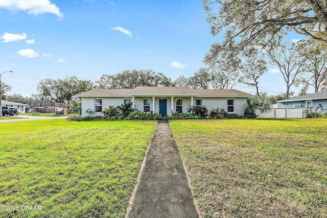 single story home with a front lawn