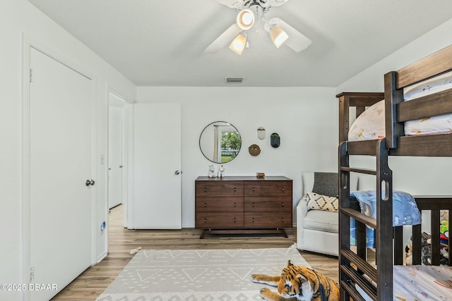 bedroom featuring light hardwood / wood-style floors and ceiling fan