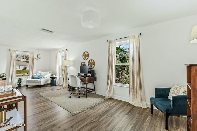 living area with hardwood / wood-style floors