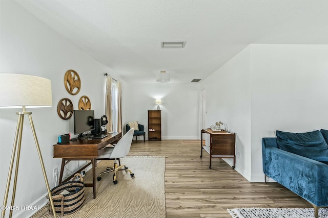 office space featuring light hardwood / wood-style floors