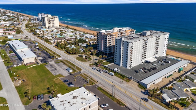 bird's eye view with a beach view and a water view