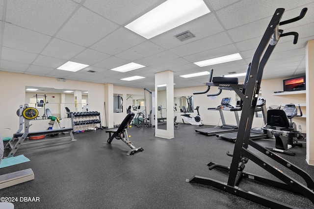 workout area with a paneled ceiling