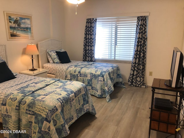 bedroom with light wood-type flooring