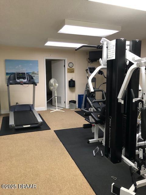 exercise room with baseboards