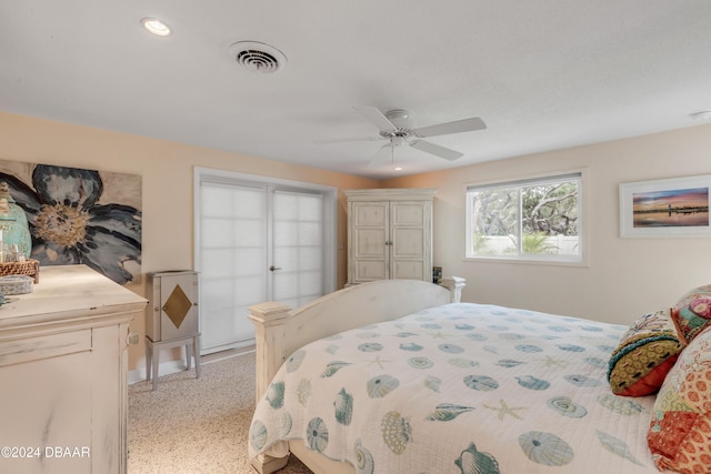 bedroom featuring ceiling fan and light carpet