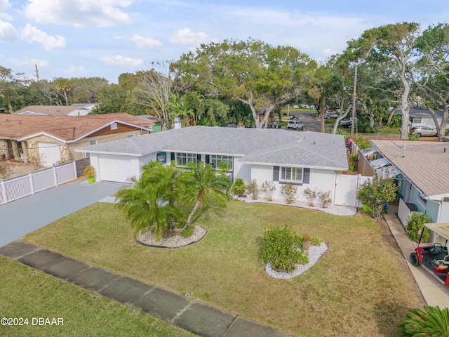 view of front of house featuring a front yard and a garage