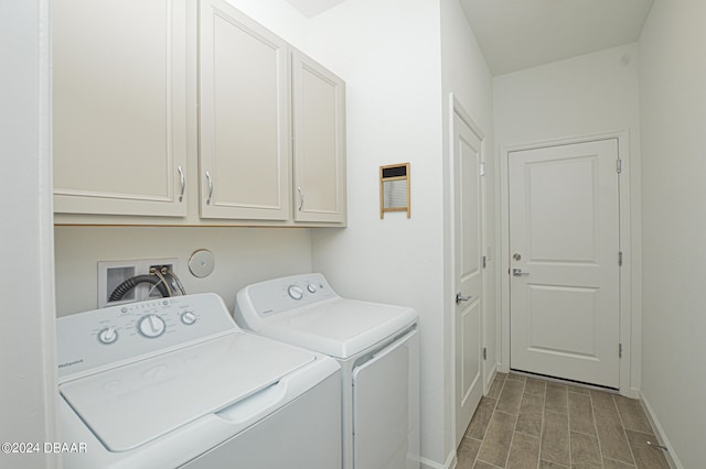 laundry room with light wood-type flooring, cabinets, and independent washer and dryer