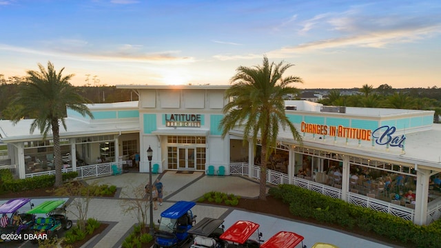 view of outdoor building at dusk