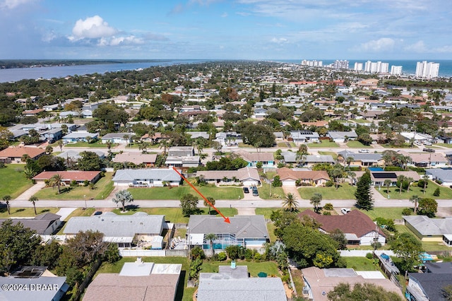 birds eye view of property featuring a water view