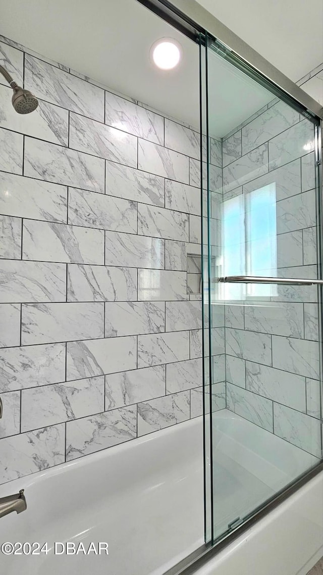 bathroom featuring enclosed tub / shower combo