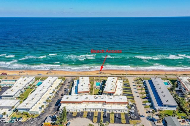 aerial view featuring a water view and a beach view