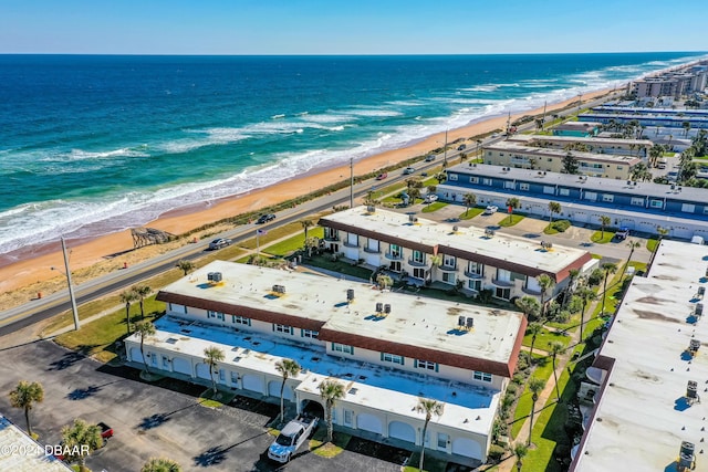 bird's eye view featuring a water view and a view of the beach