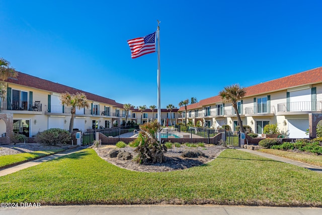 view of home's community featuring a lawn