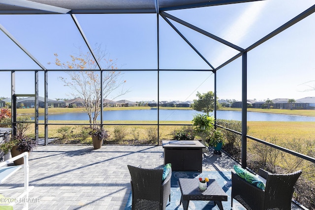 unfurnished sunroom with a water view