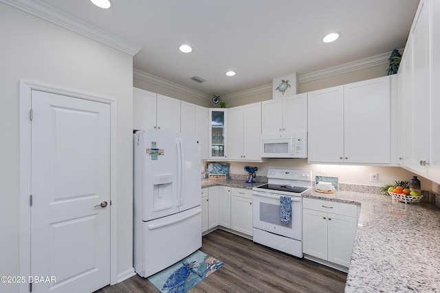 kitchen with white appliances, white cabinets, dark hardwood / wood-style flooring, and crown molding