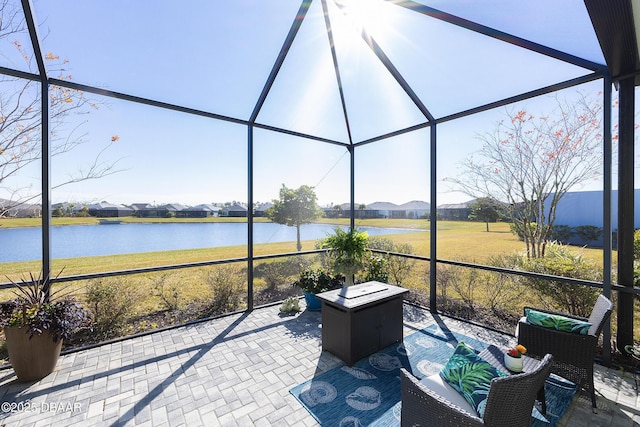 unfurnished sunroom with a water view