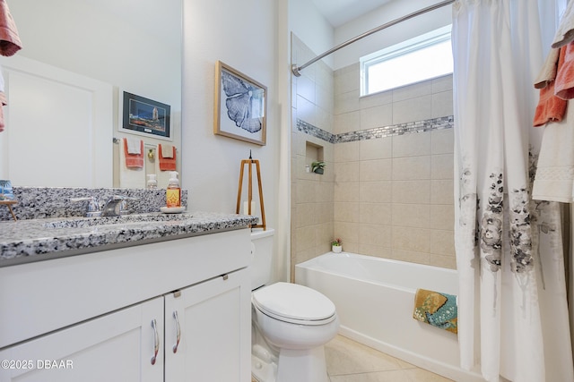 full bathroom featuring toilet, vanity, shower / bath combo, and tile patterned flooring