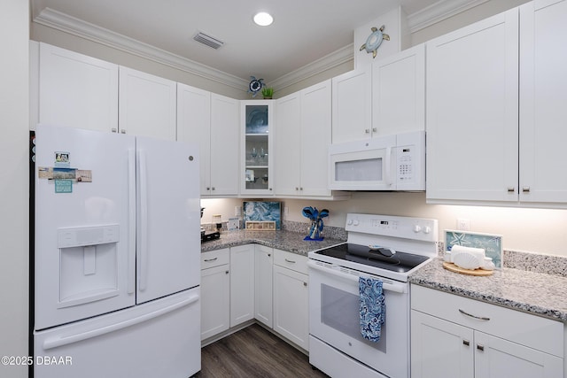 kitchen with white cabinetry, light stone counters, white appliances, and dark hardwood / wood-style floors