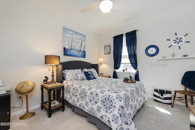 bedroom featuring ceiling fan and carpet