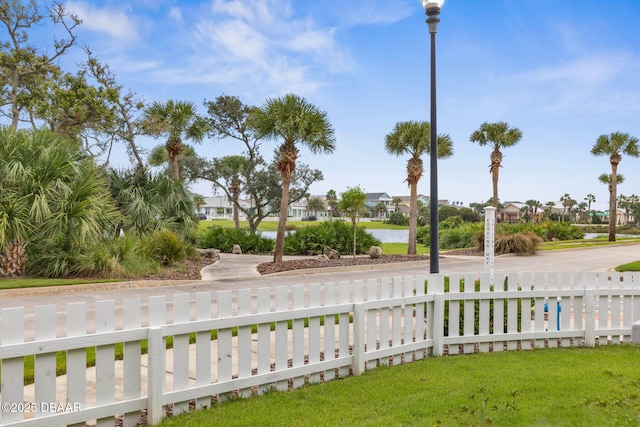view of yard with a residential view and a fenced front yard