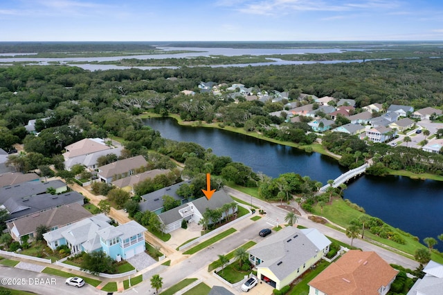 bird's eye view featuring a water view and a residential view