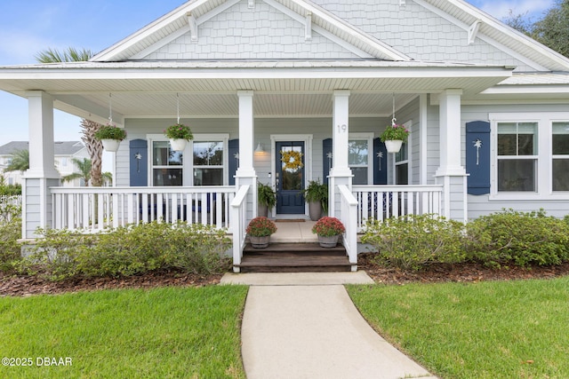 view of front of home featuring a porch and a front lawn